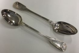 A pair of heavy George III silver basting spoons of fiddle, thread and shell pattern.