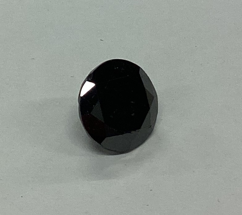 A large unmounted faceted black diamond. Approx. 1 - Image 2 of 2