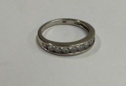 A good 18 carat gold diamond half eternity ring.