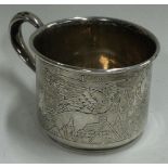 An engraved American silver christening mug.