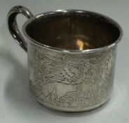An engraved American silver christening mug.