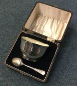 A cased silver bowl and spoon. Birmingham.