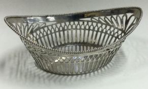 A Dutch boat shaped silver basket with reeded border.