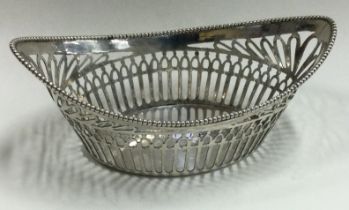 A Dutch boat shaped silver basket with reeded border.