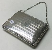 A silver card case with suspension chain. Birmingham 1916.
