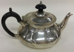 A silver bachelor teapot of fluted design. London 1907. By Pearce & Sons.