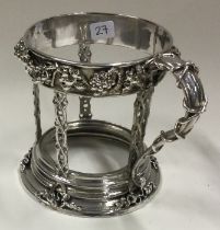 OMAR RAMSDEN: A silver cup holder. London 1923.