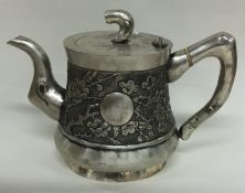 A Chinese export silver teapot. Marked to base.