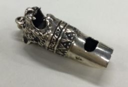 A Sterling silver whistle with figural lion decoration.