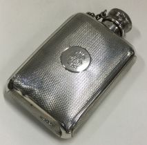 A Victorian silver hip flask. London 1870. By HWL.