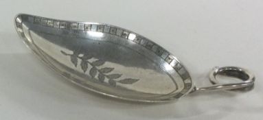 A George III leaf shaped silver caddy spoon with bright cut decoration. London 1812.