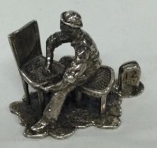A silver figure of a Charles Dickens' character; 'Jarvis'.