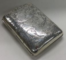 An Aesthetic Movement silver card case engraved with owls and birds. London 1882.