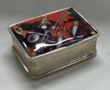 A Sterling silver hinged pill box with musical scene to front.