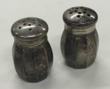 A pair of silver peppers. Marked to bases.