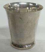 A 19th Century silver beaker with coin to base.
