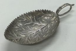 A George III silver leaf shaped caddy spoon. Birmingham. Marked to handle.