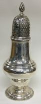 A large Scottish silver caster. By Hamilton & Inches.