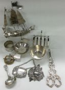 A silver plated toast rack together with a tea strainer, wine label etc.