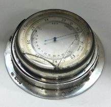 A heavy novelty silver weather barometer. London 1902.