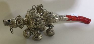 A Georgian style chased silver rattle.
