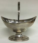 PETER & ANN BATEMAN: A large Georgian silver swing handled basket. London 1791.