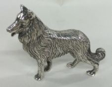 A silver figure of a dog. Marked to side. London 1973.