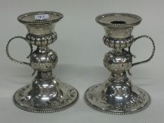 A novelty pair of Victorian silver chambersticks. London 1859. By Robert Hennell.