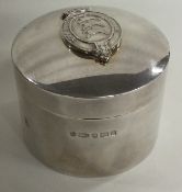 A chased silver box with lift off cover depicting the Goodwood Racecourse emblem. London 1999.