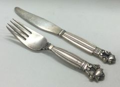 GEORG JENSEN: A silver child's knife and fork of acorn pattern.