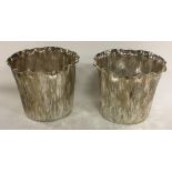 A pair of silver plated vases with bark finish. By Elkington & Co.