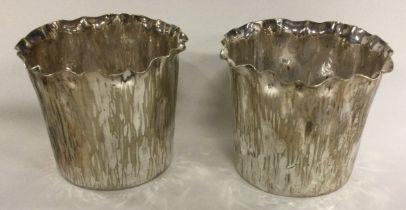 A pair of silver plated vases with bark finish. By Elkington & Co.