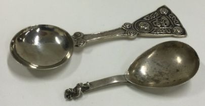 A Lincoln Imp silver caddy spoon, Birmingham 1916, together with an Iona caddy spoon by IMC.