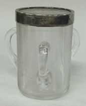 A silver mounted glass match striker in the form of a tyg. London 1908.