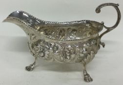 An 18th Century chased silver sauce boat. London 1757. By William Sumner.