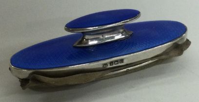 A silver and enamelled nail buffer. Birmingham. Circa 1920s. By Alexander Clark.