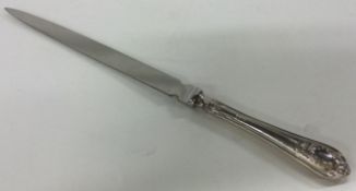 A silver handled letter opener. London 1996.