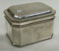 A large silver tea caddy with hinged lid. London 1925. By William Bruford & Son.
