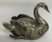 A large silver plated figure of a swan.