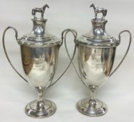 A fine pair of silver horse racing trophy cups and covers. Birmingham 1927. By Charles Weale.