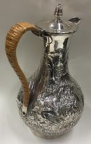 A George III silver coffee jug with wicker covered handle. London 1784. By Wakelin & Taylor.