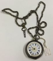 A small silver fob watch with white enamelled dial.