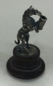 A silver musical figure on plinth bearing import marks.