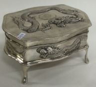 A heavy Chinese export silver jewellery box embossed with dragons. Circa 1900.