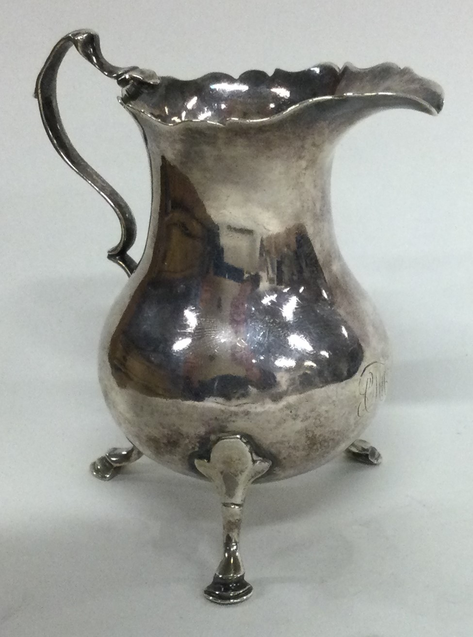 An 18th Century silver jug. London 1764. By Samuel Meriton.
