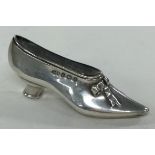 A silver pin cushion in the form of a shoe. Birmingham 1904. By Levi & Salaman.