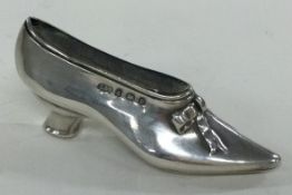 A silver pin cushion in the form of a shoe. Birmingham 1904. By Levi & Salaman.