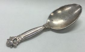 A Danish silver child's spoon. Marked Sterling. Possibly Georg Jensen?
