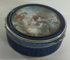 A large late 19th/early 20th Century French silver and enamelled snuff box with plaque to front.