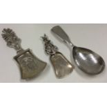 Two silver caddy spoons, London 1832 and Chester 1906, together with an Italian caddy spoon.